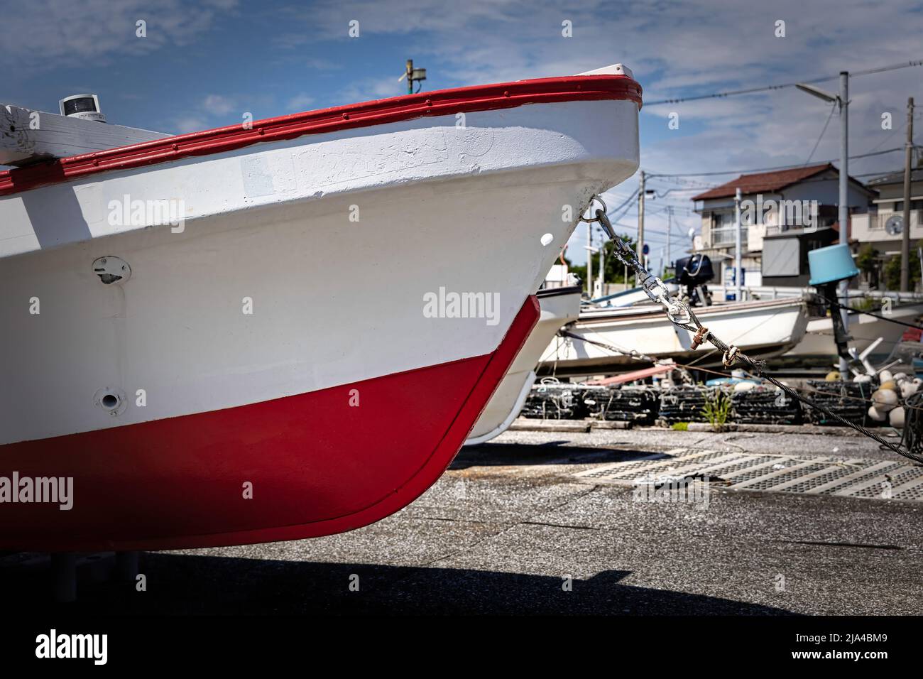 A fishing boat sits on the ramp in the little fishing village of Arisaki near Yokosuka, Japan. Stock Photo