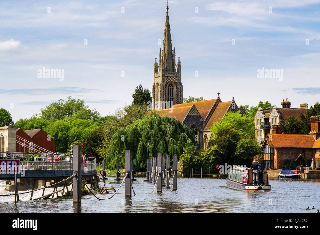 Scene with Narrowboat passing the weir on the River Thames towards the town. Marlow, Buckinghamshire, England, UK, Britain Stock Photo