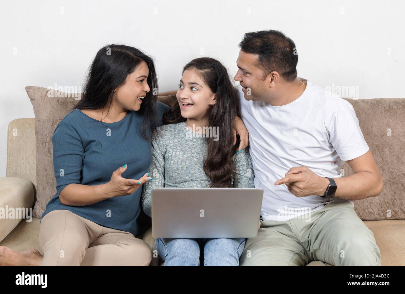 parents with daughter celebrating together Stock Photo