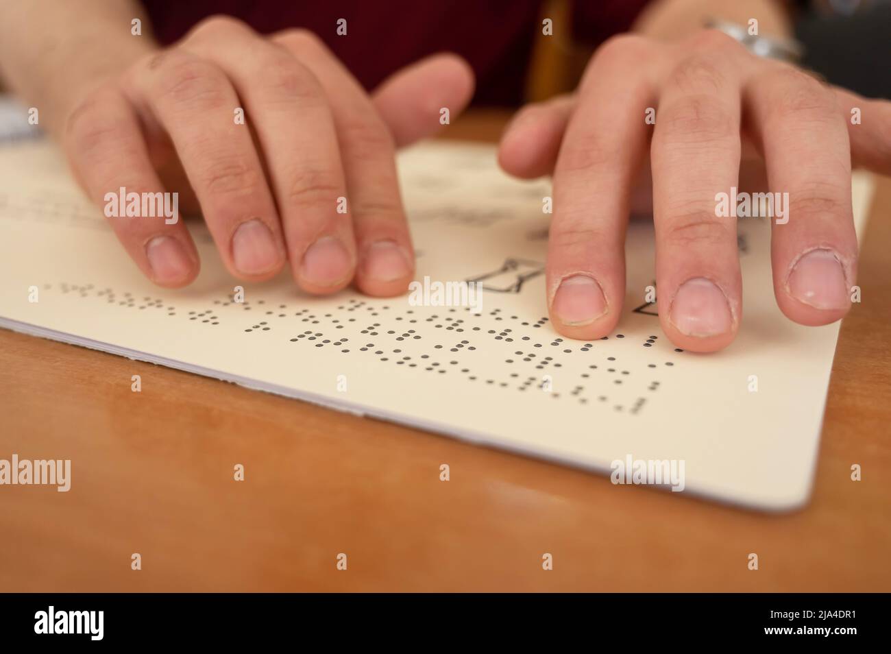 Visually impaired man reading a braille book Stock Photo Alamy