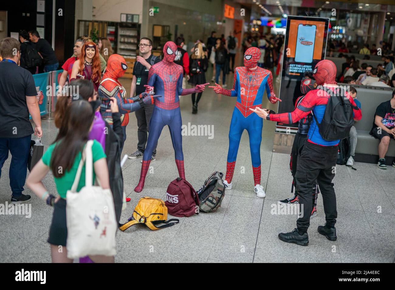 Cosplayers dressed as Spiderman during the first day of the MCM Comic Con at at the ExCel London in east London. Picture date: Friday May 27, 2022. Stock Photo