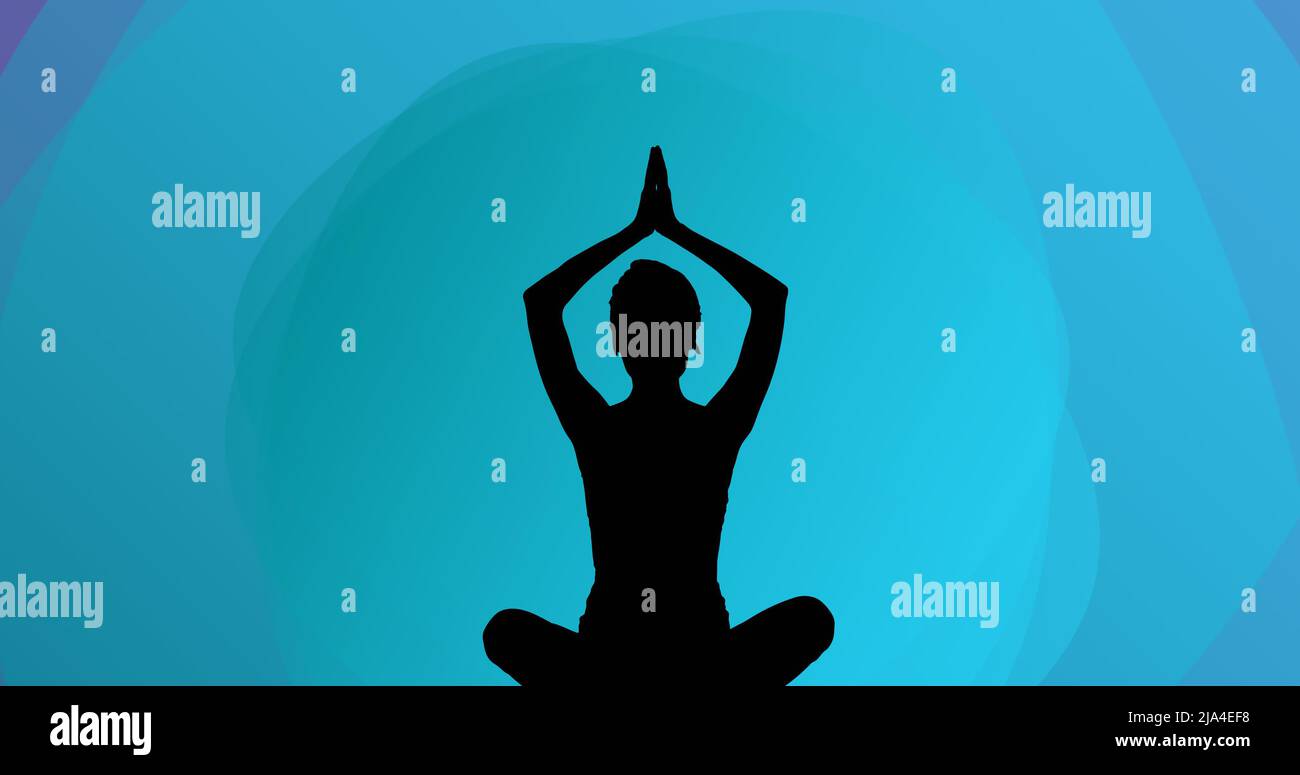 Image of woman meditating silhouette on blue background Stock Photo - Alamy