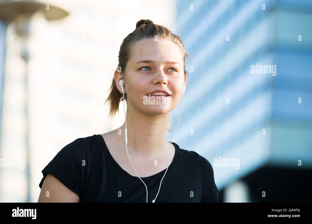 Closeup portrait of young woman with headphones Stock Photo - Alamy