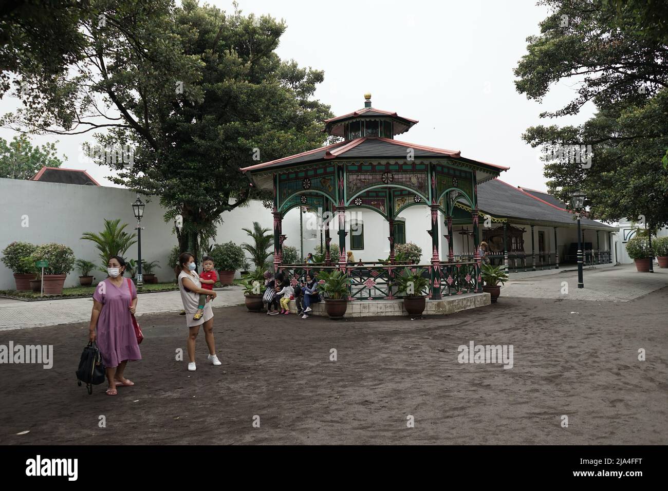 Tourists walk and sit around Kraton Yogyakarta area in Indonesia Stock Photo