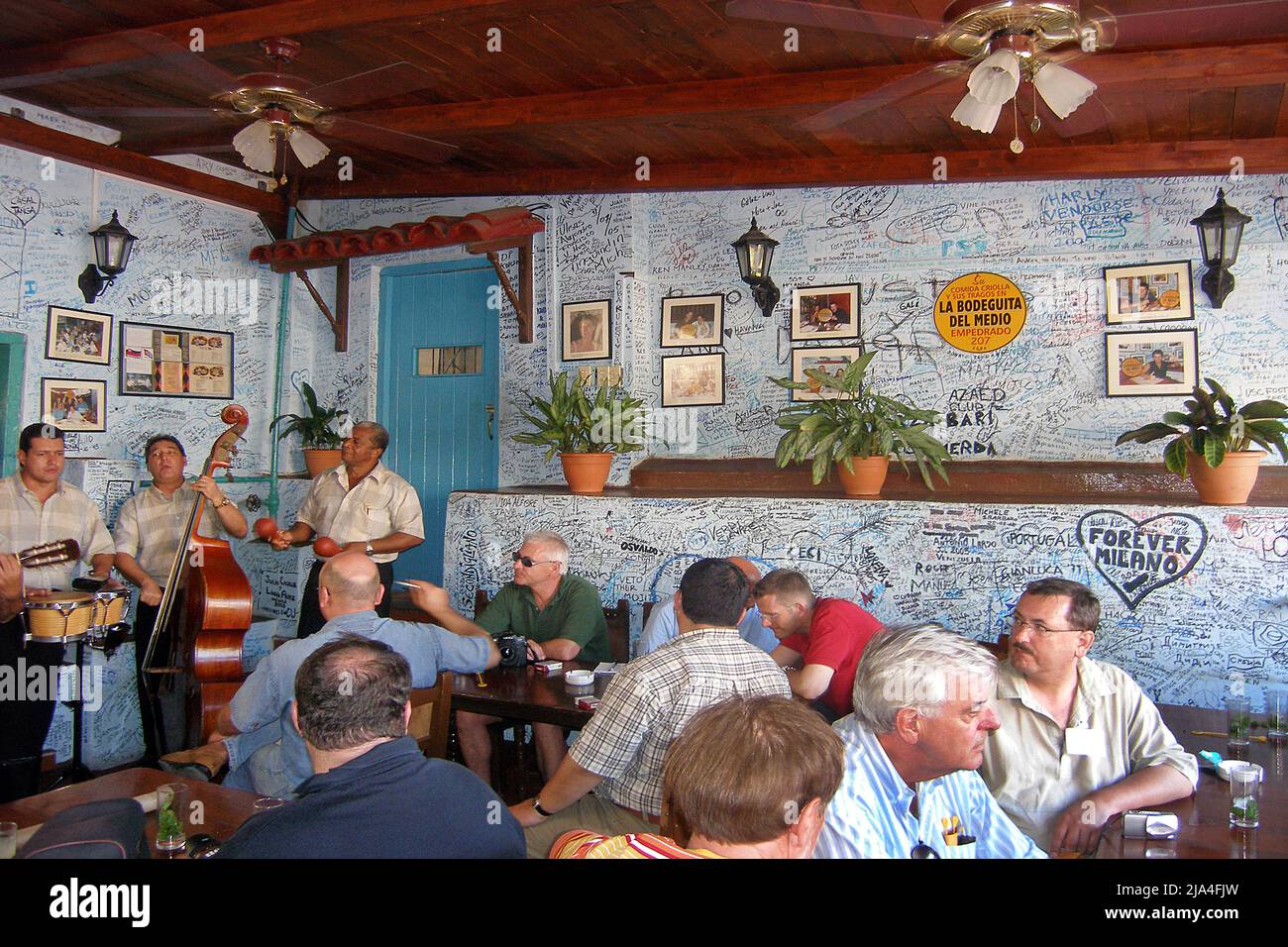Locals and tourists in the bar La Bodeguita del Medio, most popular bar in Havana, Cuba, Caribbean Stock Photo