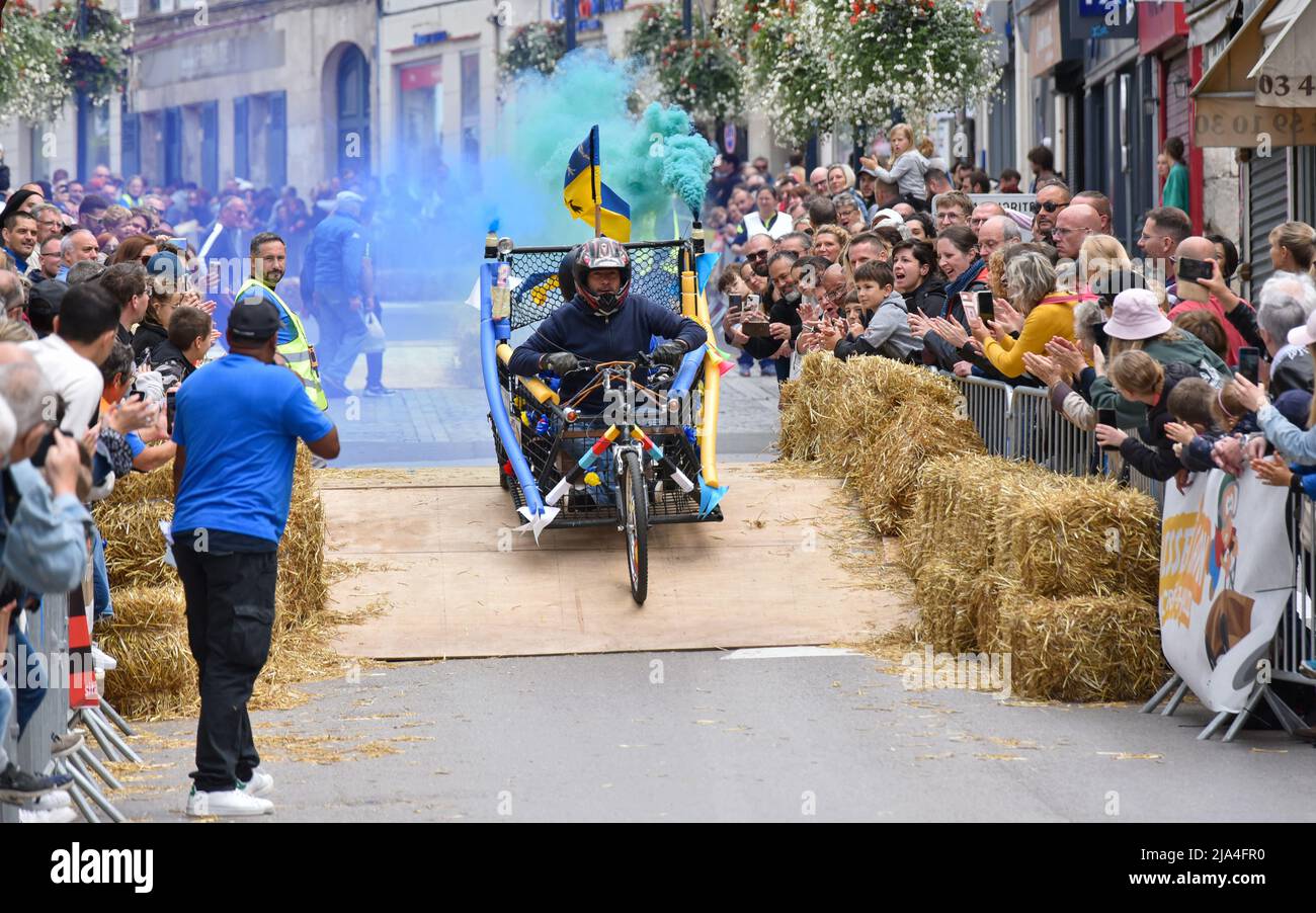 First edition of a soapbox race in the heart of the city center of Crépy-en-Valois. Homemade soap box hurtling down the slope of the main street. Stock Photo