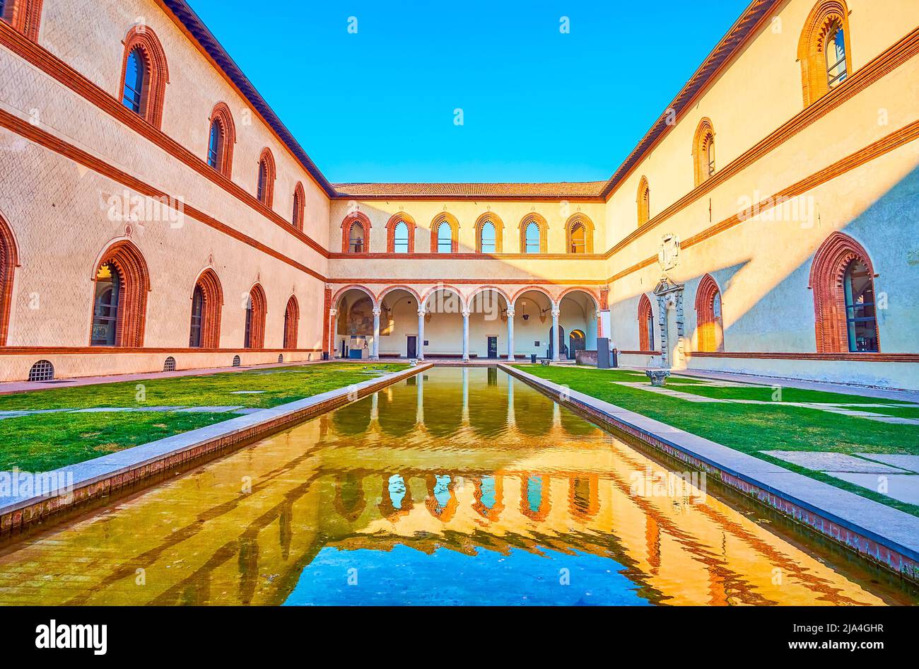 The great reflection of the Renaissance style loggia of Corte Ducale in the water of the pool, Sforza's Castle, Milan, Italy Stock Photo