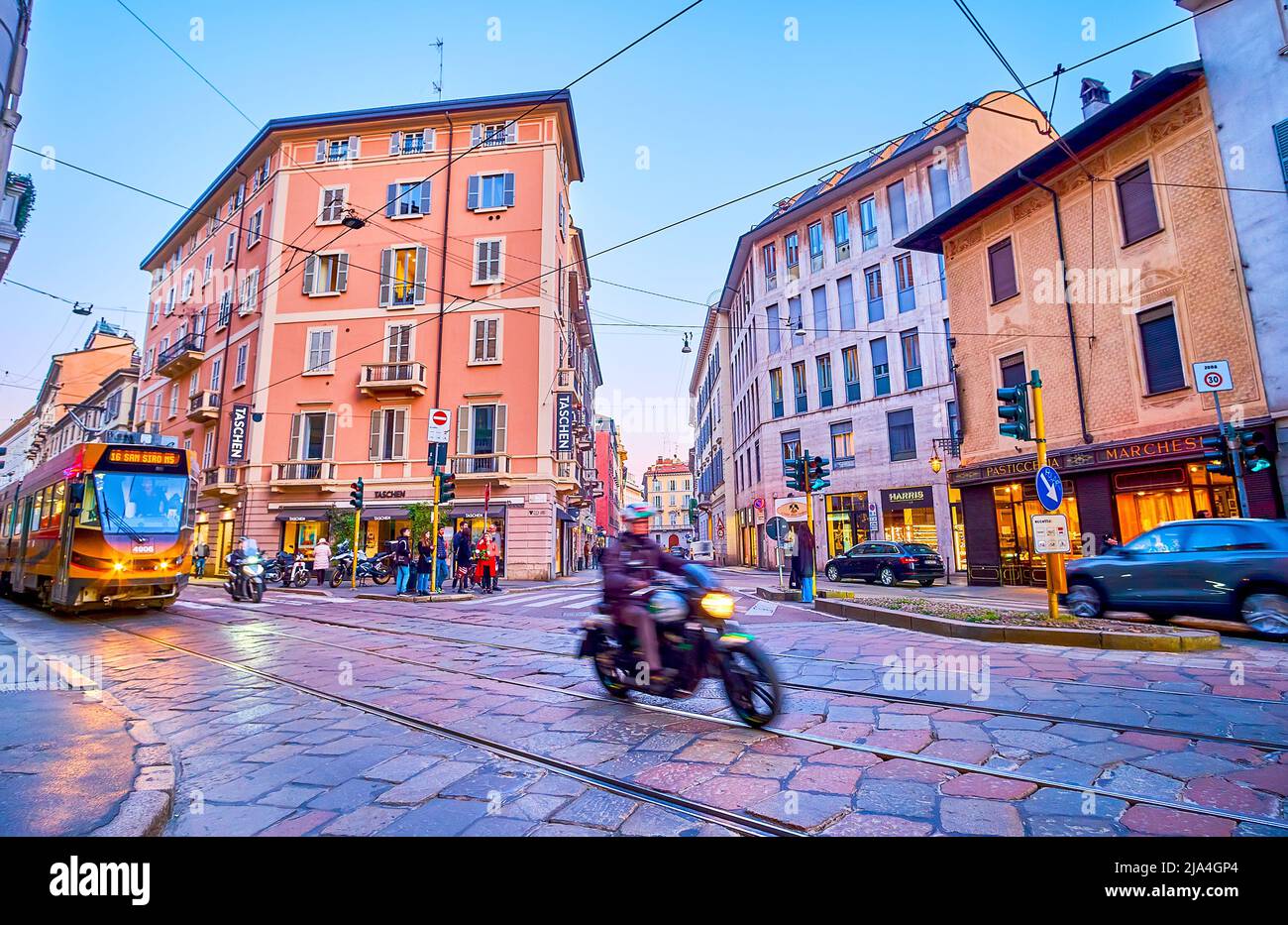MILAN, ITALY - APRIL 5, 2022: The bike rides along via Meravigli street in late evening time, on April 5 in Milan, Italy Stock Photo