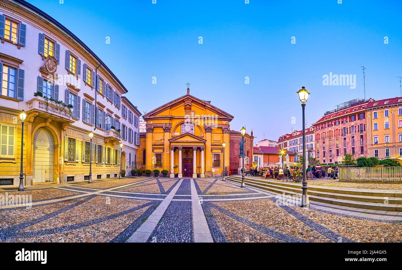 MILAN, ITALY - APRIL 5, 2022: Panorama of the Piazza Borromeo with popular outdoor restaurant neighbors with old Church of Santa Maria Podone, on Apri Stock Photo