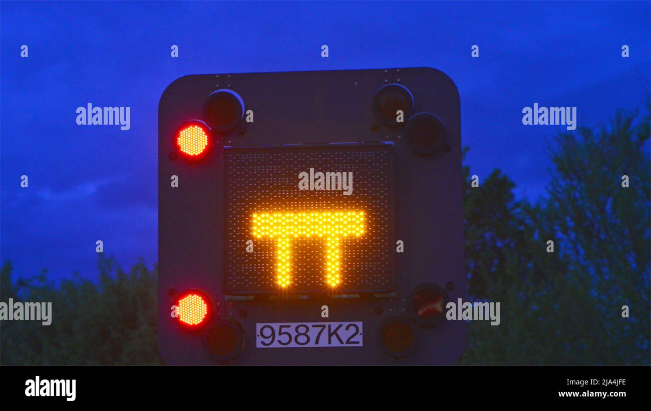 blocked motorway flashing warning sign at twilight leeds united kingdom Stock Photo