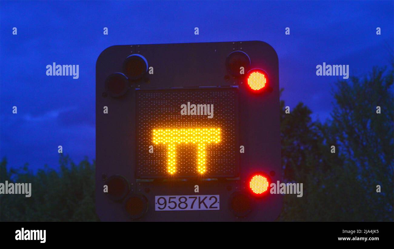 blocked motorway flashing warning sign at twilight leeds united kingdom Stock Photo