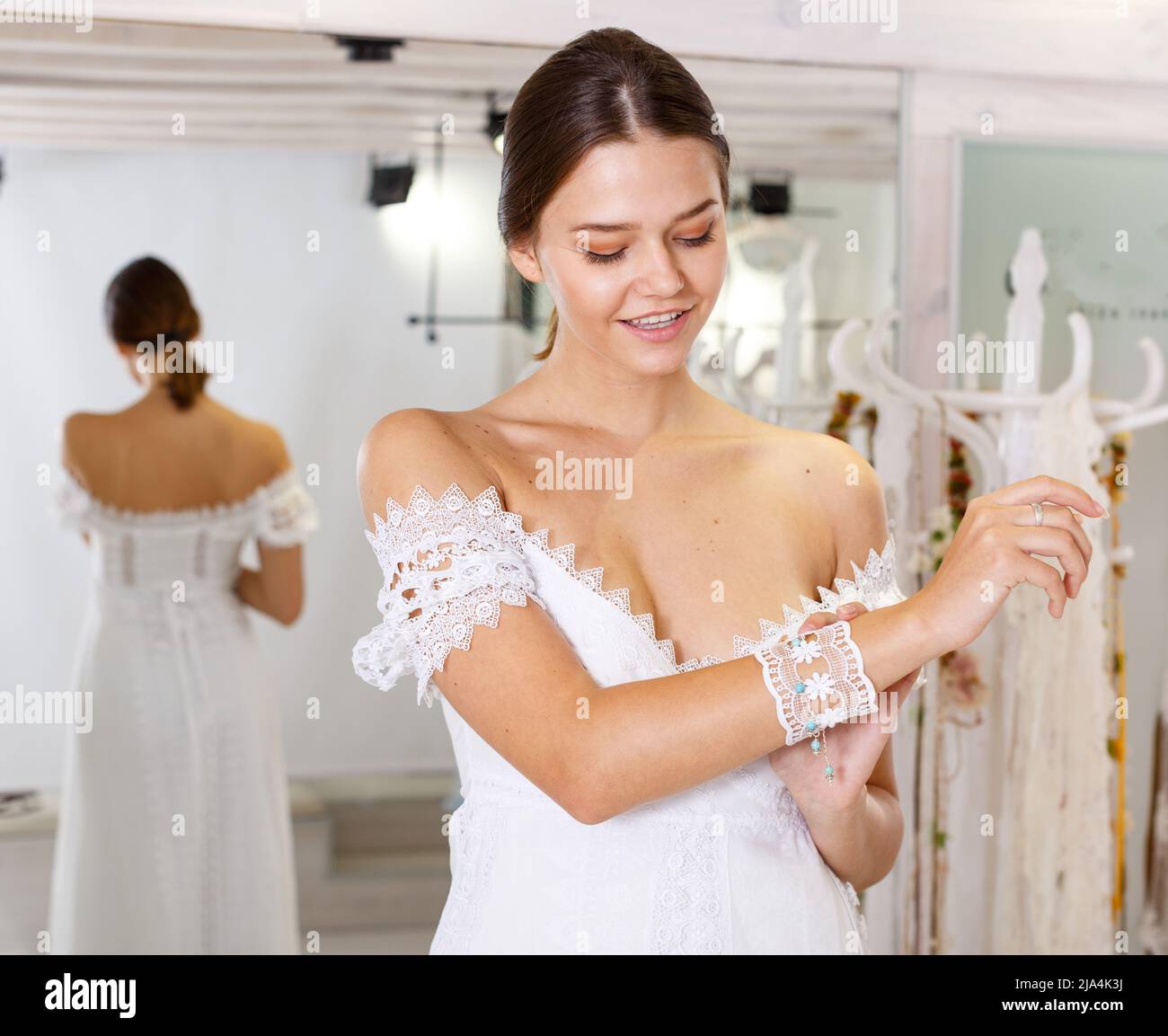 Woman flaunting dressed in wedding gown Stock Photo - Alamy