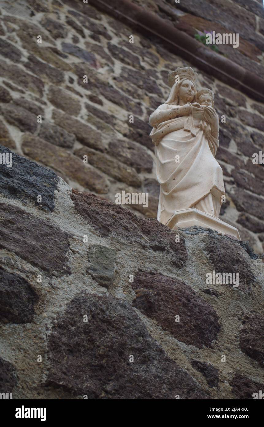 An stone Angel in front of a Church in Castelsardo. Stock Photo
