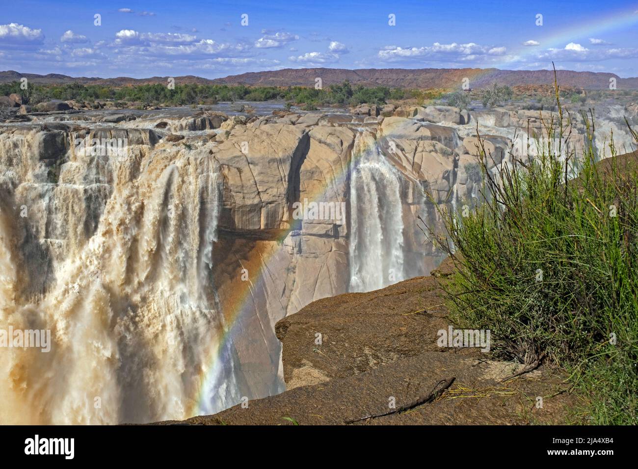 Rainbow over waterfall on the Orange River in the Augrabies Falls National Park in the Northern Cape Province, South Africa Stock Photo