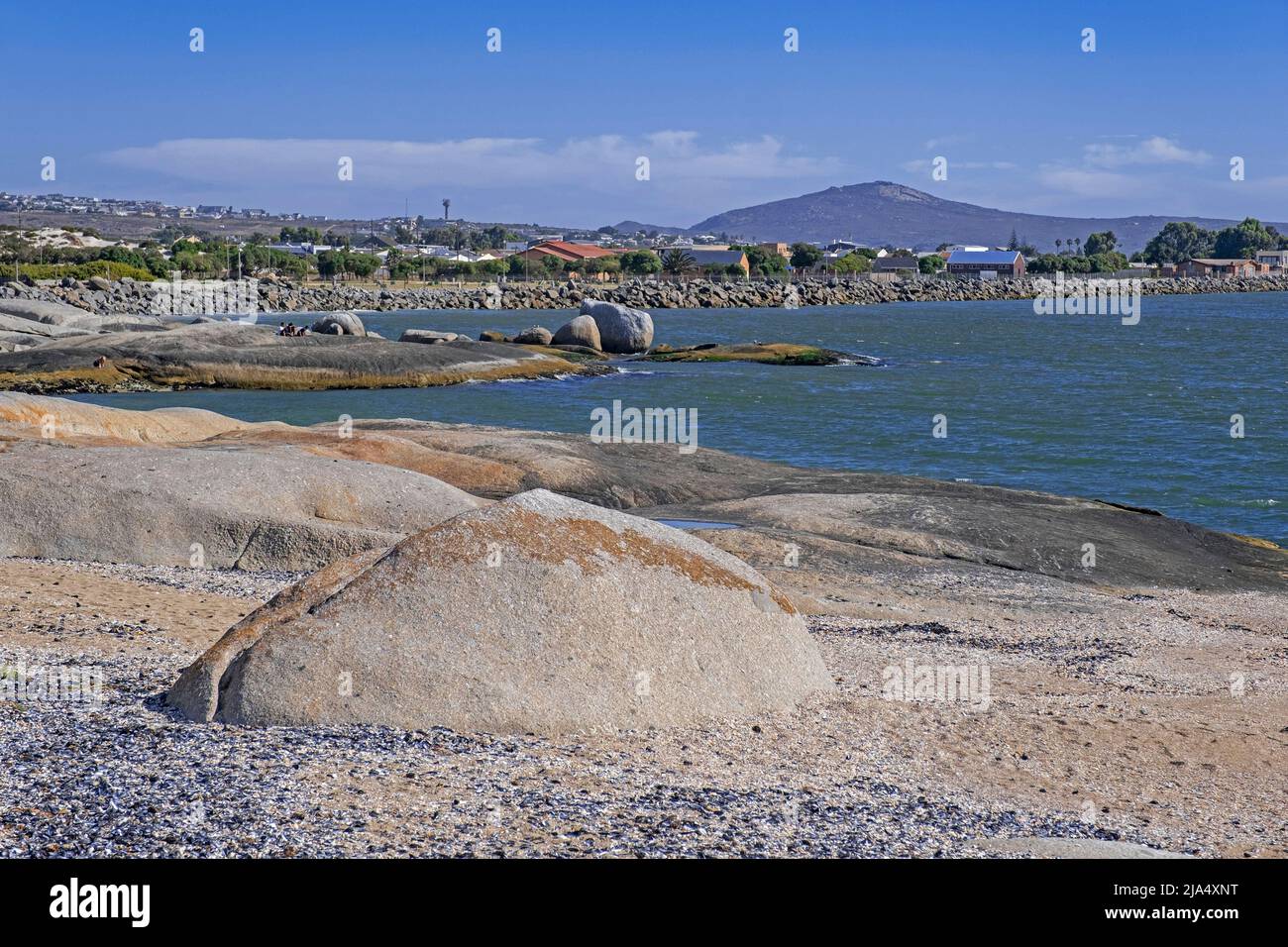 Large granite boulders on beach along the Atlantic Ocean at Langebaan, West Coast, Western Cape Province, South Africa Stock Photo