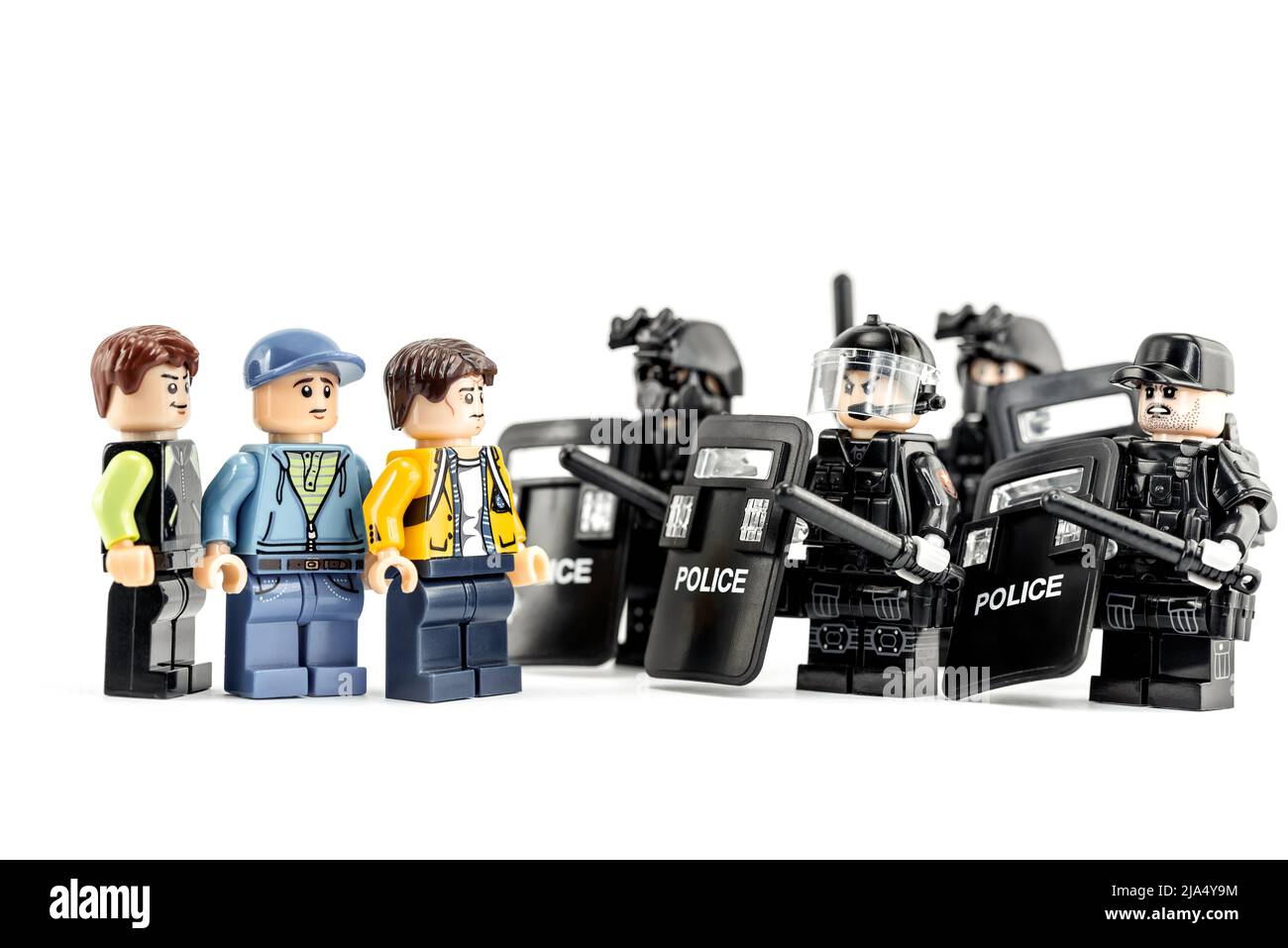 Group of protesters in front of riot police. Illustrative editorial. May 16, 2022 Stock Photo