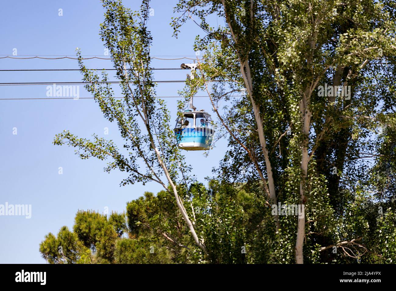 Cableway. Cable car in Madrid that connects the Parque del Oeste with the Casa de Campo in Madrid. Clear day with a blue sky, in Spain. Europe. Photo Stock Photo