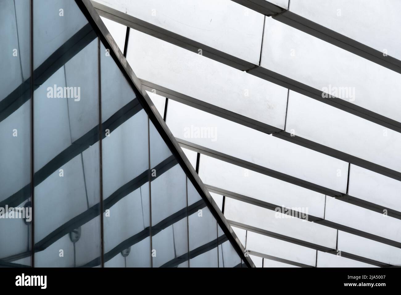 Details in closeup of glass metal and concrete pillars beams and