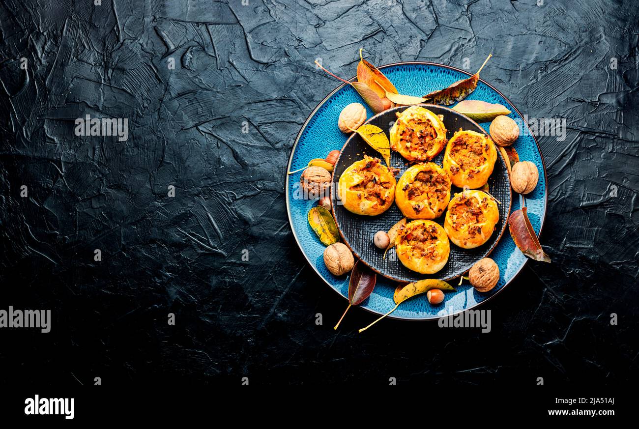 Autumn homemade pastries.Seasonal buns with minced meat and pumpkin