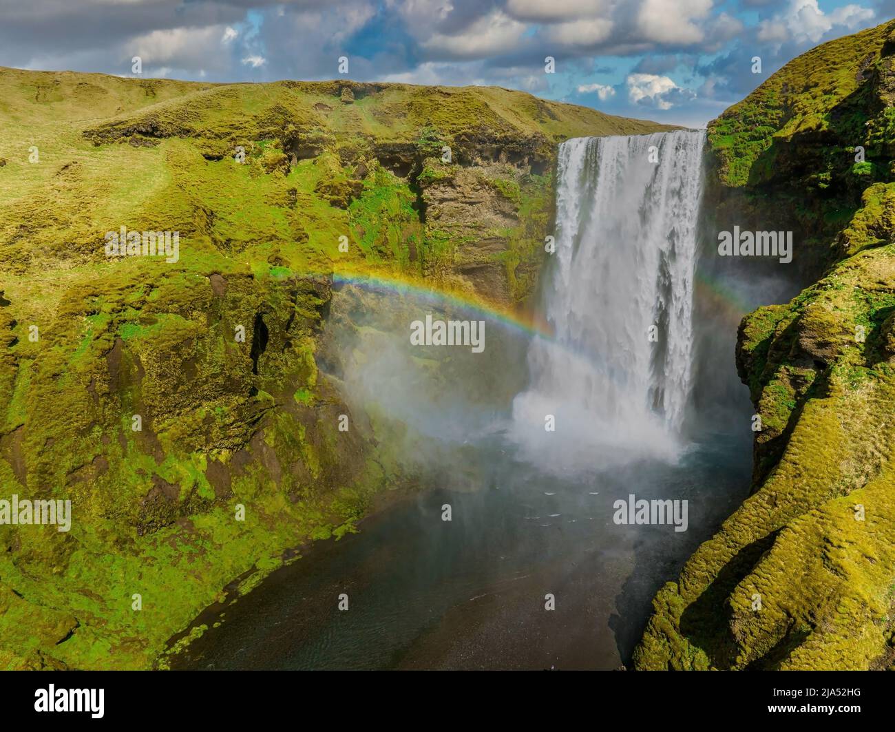 Famous Skogafoss waterfall with a rainbow. Dramatic Scenery of Iceland ...