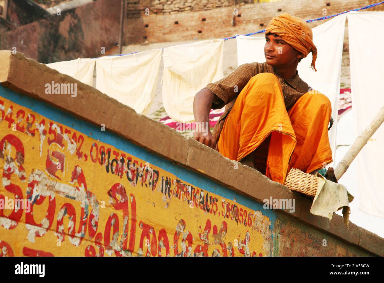 India, Uttar Pradesh, Benares (Varanasi) Portrait of a young snake charmer on the city ghats Stock Photo