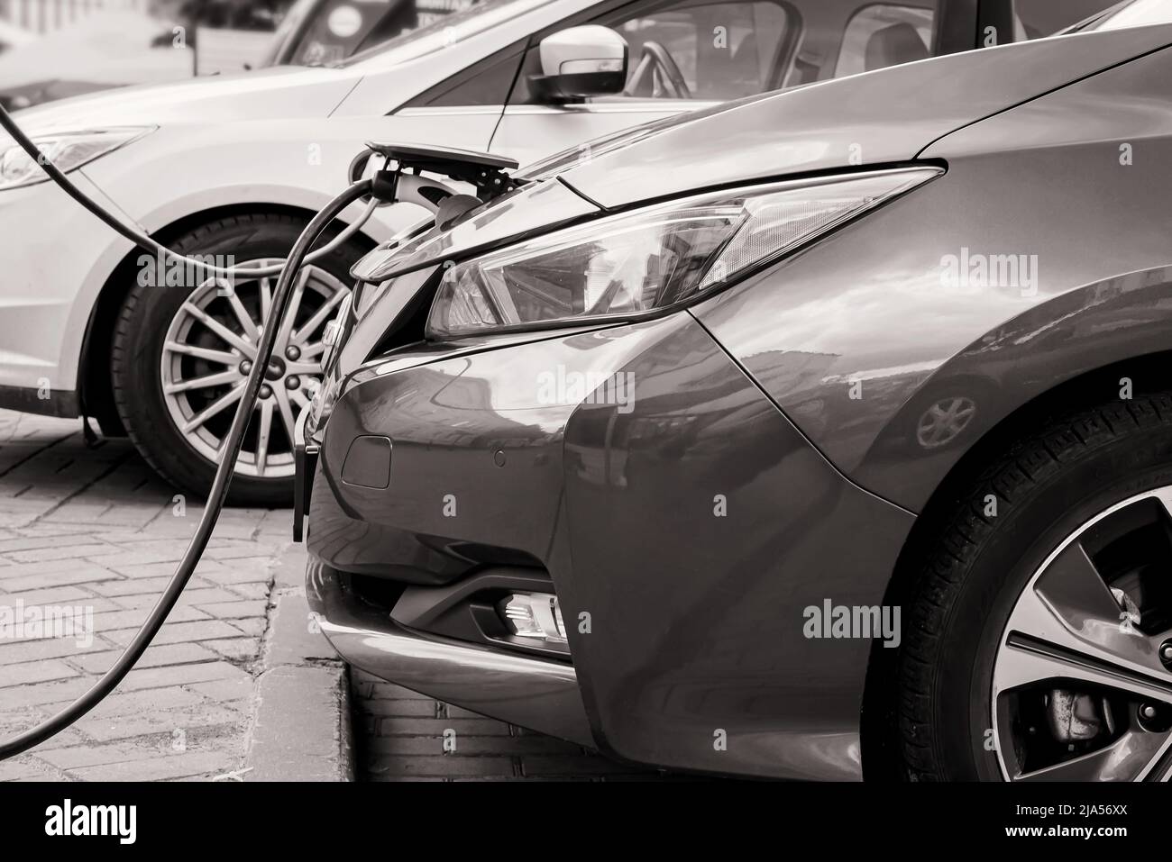 Electric car at the charging station. Ecology. Eco-friendly transport ... - Luxury Eco Properties With Electric Car Charging