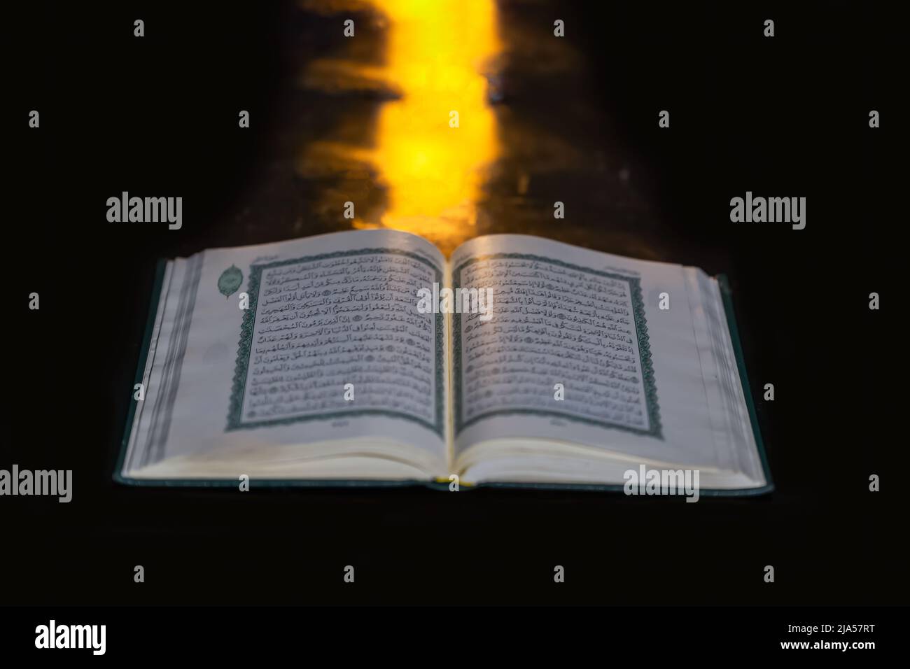 An open holy Al-Quran - Islamic Concept. selective focus. Stock Photo