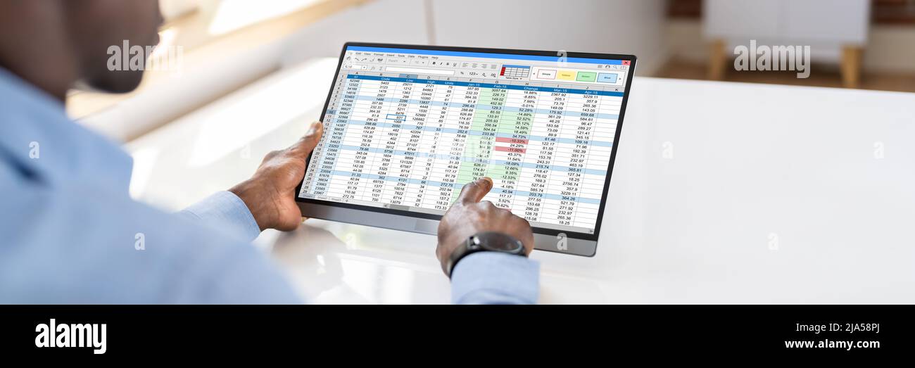 Electronic Spreadsheet Analyst Or Auditor Using Software On Tablet Stock Photo