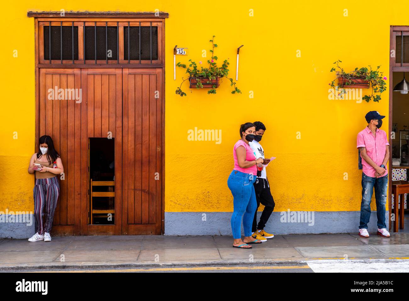 Peruvian People Waiting Outside A Medical Centre, Barranco District, Lima, Peru. Stock Photo