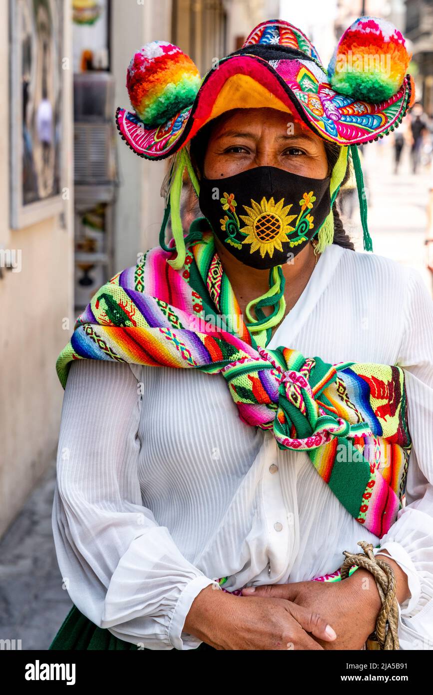 An Indigenous Woman In Traditional Costume In The Historical District Of Lima, Lima, Peru. Stock Photo