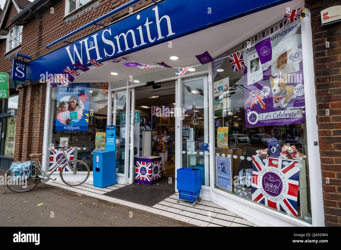 Queen Elizabeth II Platinum Jubilee bunting and shop window display decorations in WH Smith store, Surrey, England, UK, 2022 Stock Photo