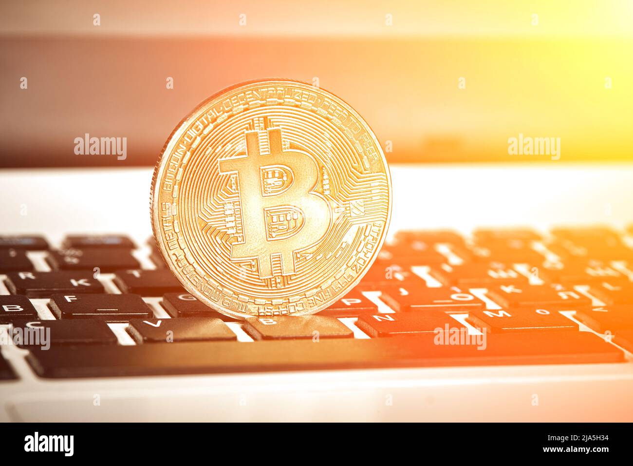 Coin crypto currency bitcoin lies on the keyboard background theme gold ...