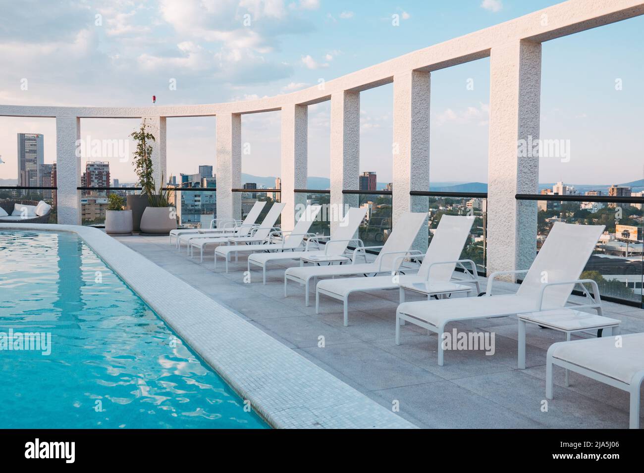 Modern Apartment Building With Rooftop Pool photo