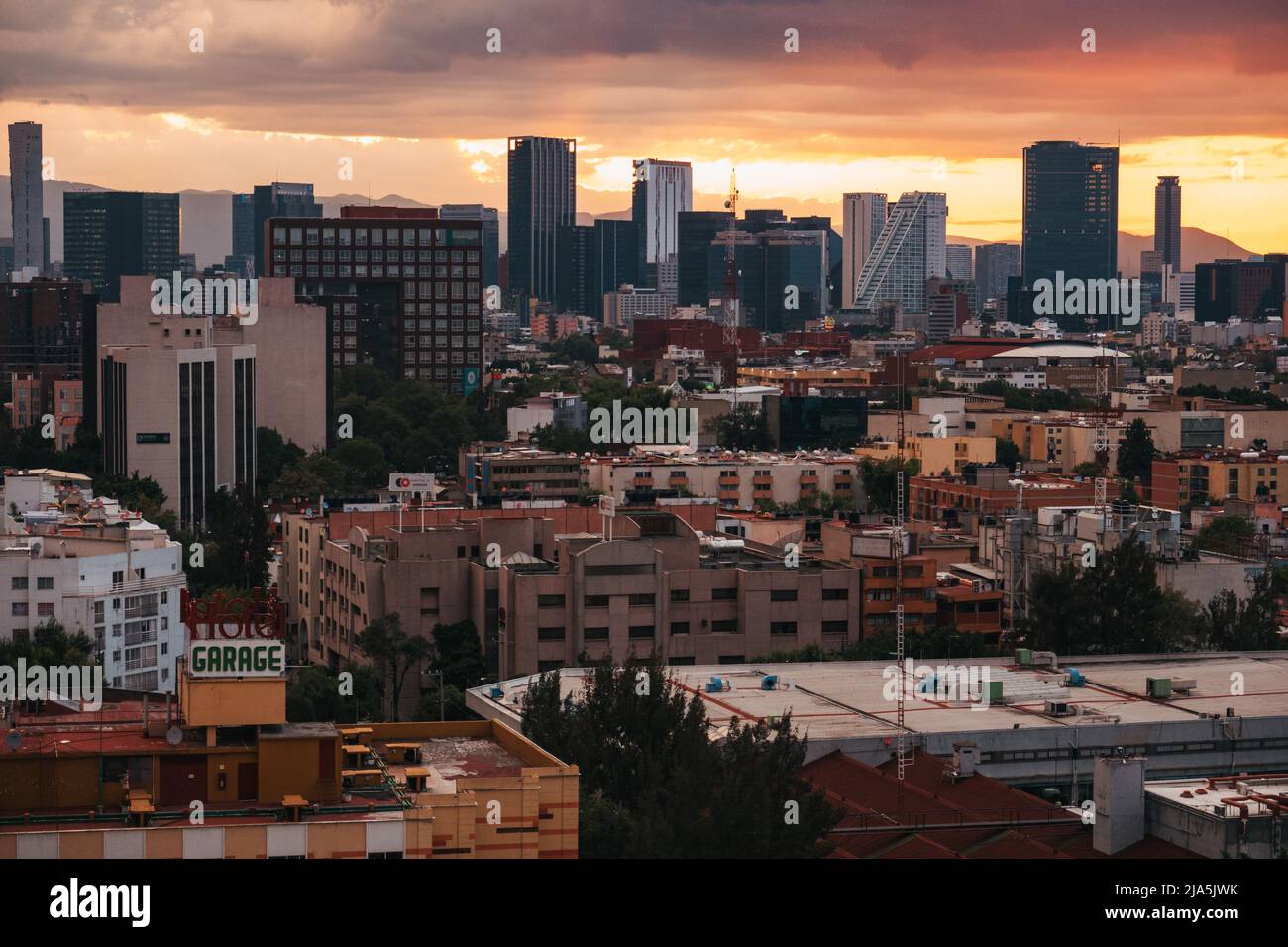 A dramatic and fiery sunset over the skyline of Mexico City, Mexico Stock Photo