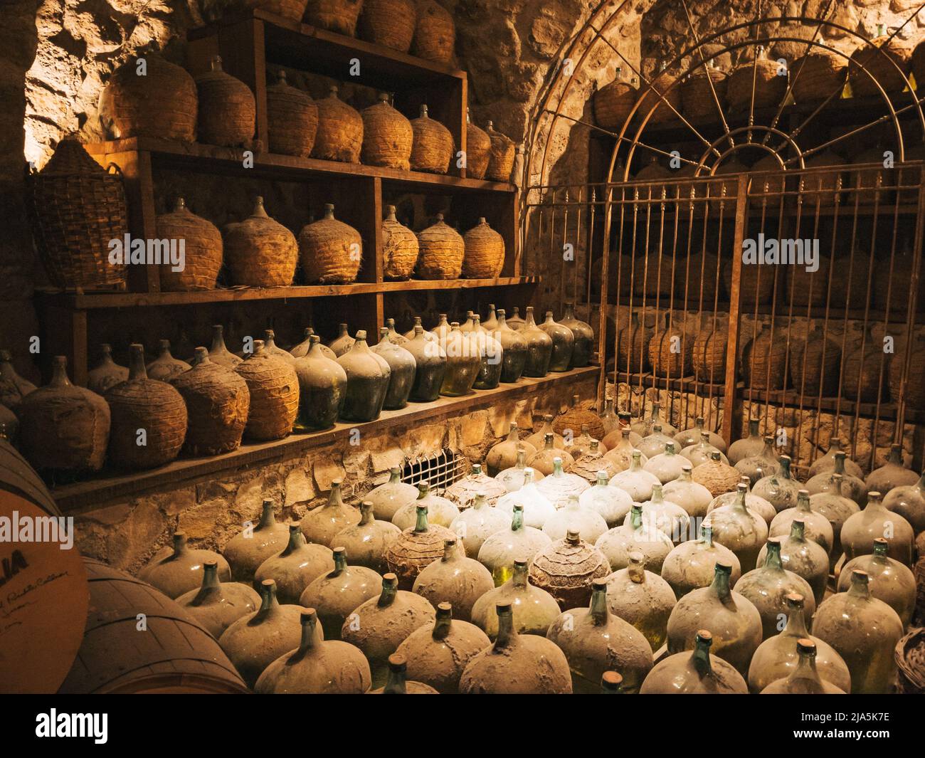 old bottles of tequila coated in a thick layer of dust on display in the cellar at the Jose Cuervo Distillery in Tequila, Jalisco, Mexico Stock Photo