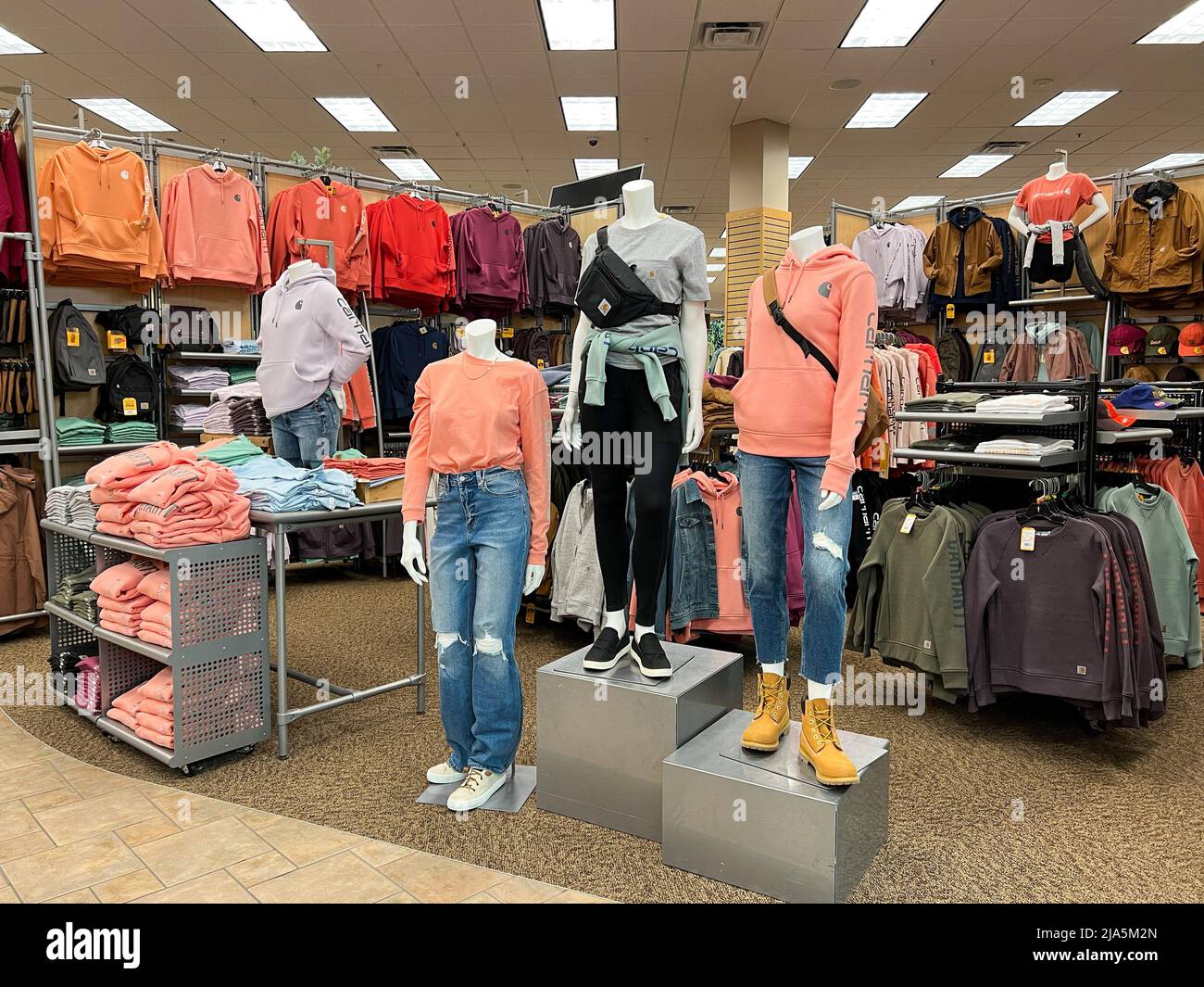 Springfield, IL USA - May 2, 2022: A display of women’s Carhartt clothing for sale at the Scheels Sporting Goods store in Springfield, Illinois. Stock Photo