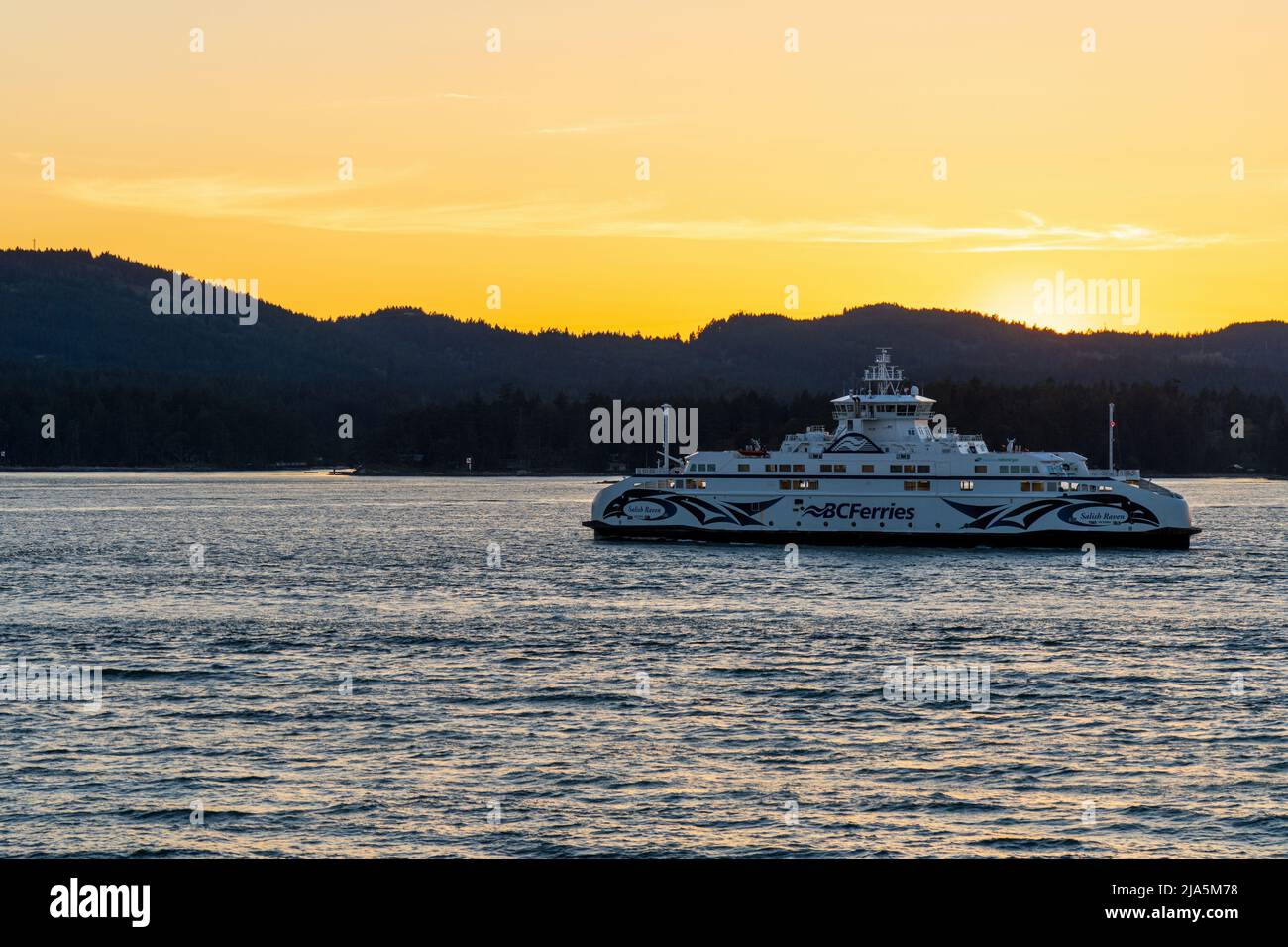 British Columbia, Canada - April 14 2021 : BC Ferries, Sunset sky over the pacific ocean, Southern Gulf Islands, Swartz Bay, Strait of Georgia. Stock Photo
