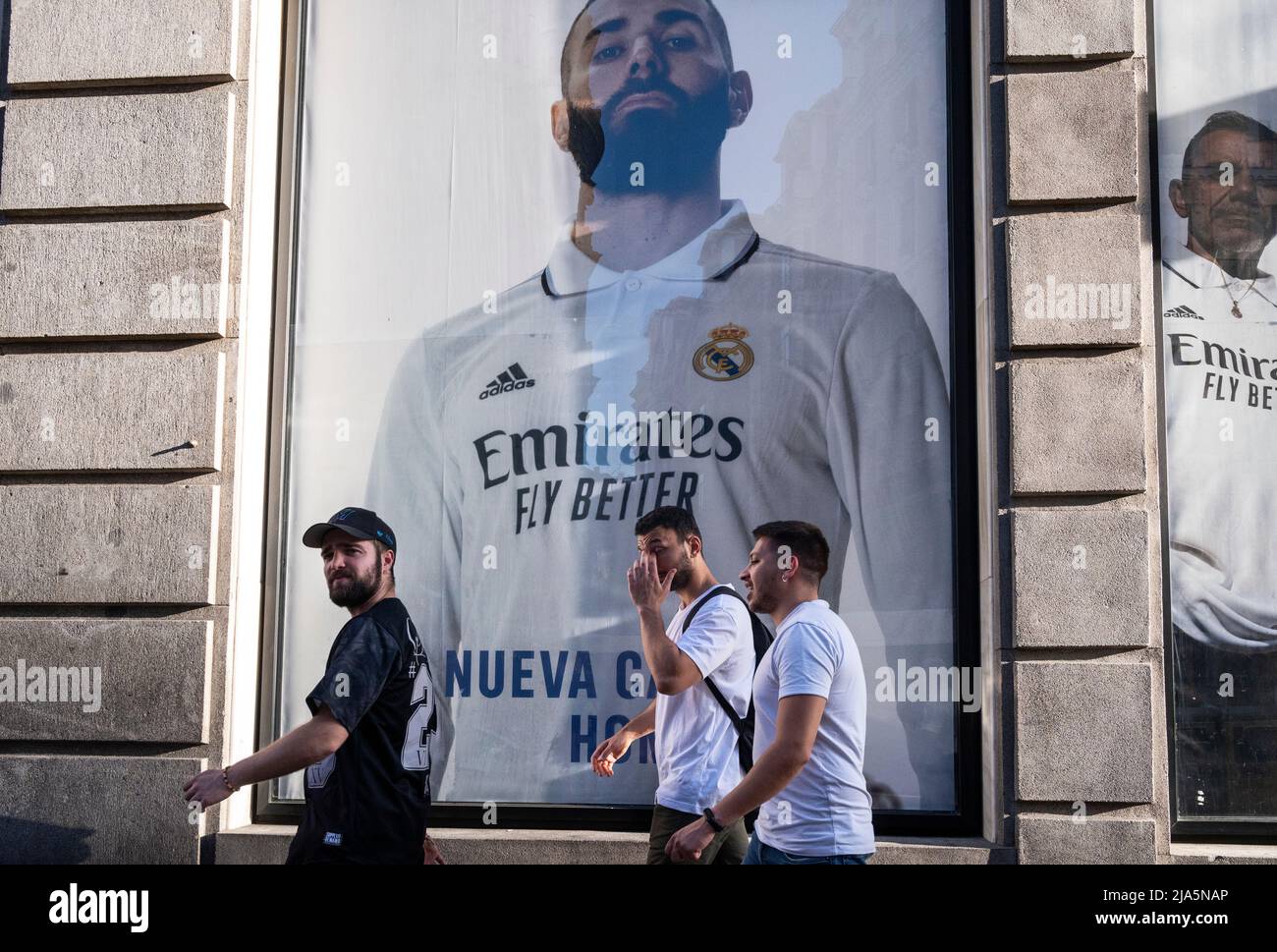 Madrid, Spain. 26th Mar, 2022. Pedestrians walk past the French