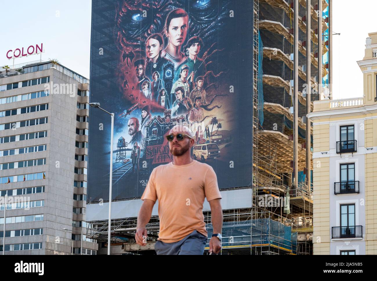 Madrid, Spain. 28th May, 2022. A pedestrian walks past a large street advertisement billboard from the American global on-demand Internet streaming media provider Netflix featuring Stranger Things Season 4 TV show in Spain. Credit: SOPA Images Limited/Alamy Live News Stock Photo