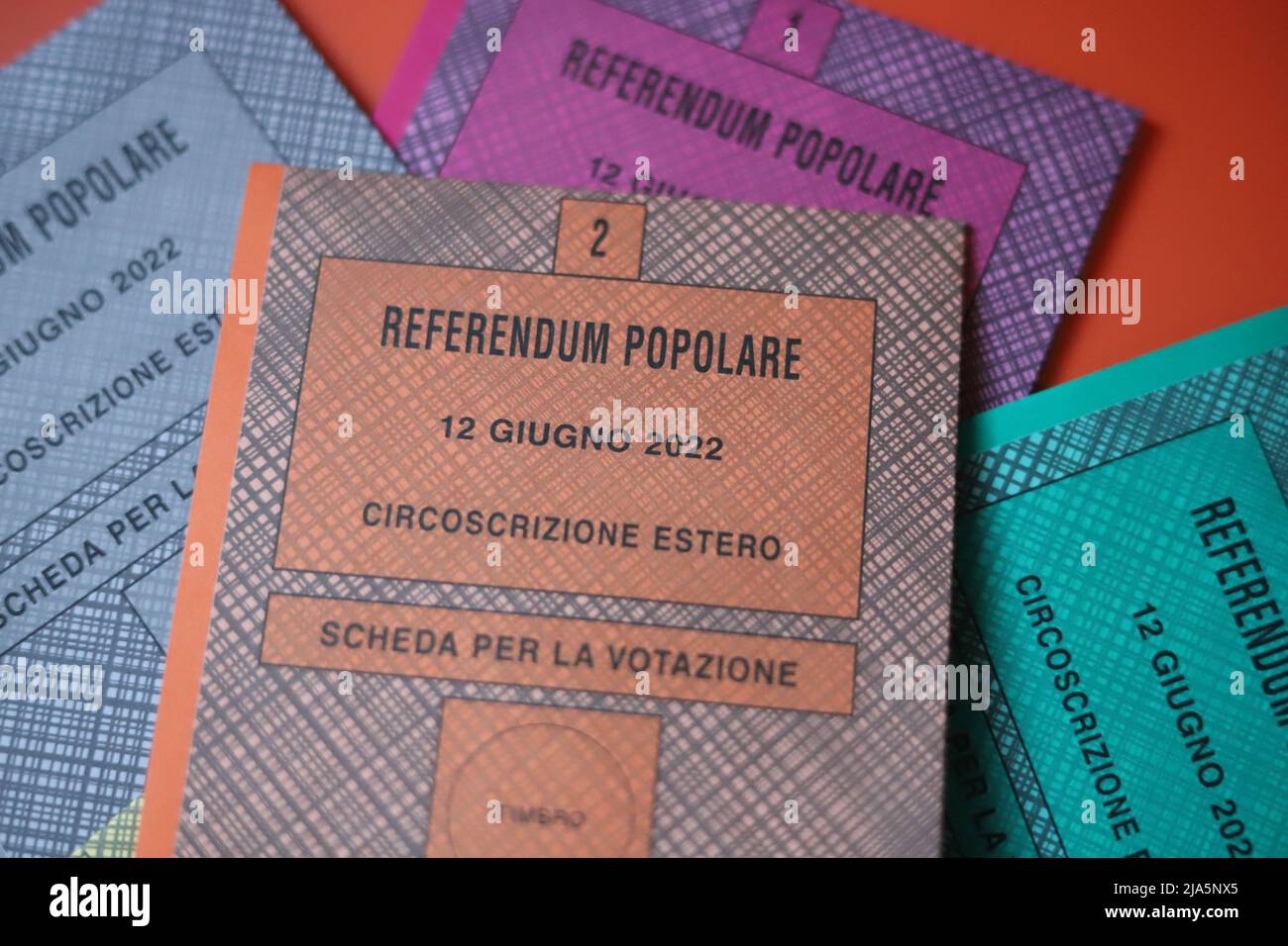 Rome, Italy. 27th May, 2022. Italian citizens living abroad are receiving letters with information about the 'Referendum Popolari Abrogativi 12 Giugno 2022' the Popular Repeal Referendums on June 12, 2022.  1. red ballot for Referendum No. 1: repeal of the Consolidated Text of the provisions on incandidability and prohibition from holding elective and government posts resulting from final sentences for non-culpable offences 2. orange ballot for referendum No 2: limitation of precautionary measures: repeal of the last sentence of Article 274(1)(c) of the Code of Criminal Procedure Stock Photo