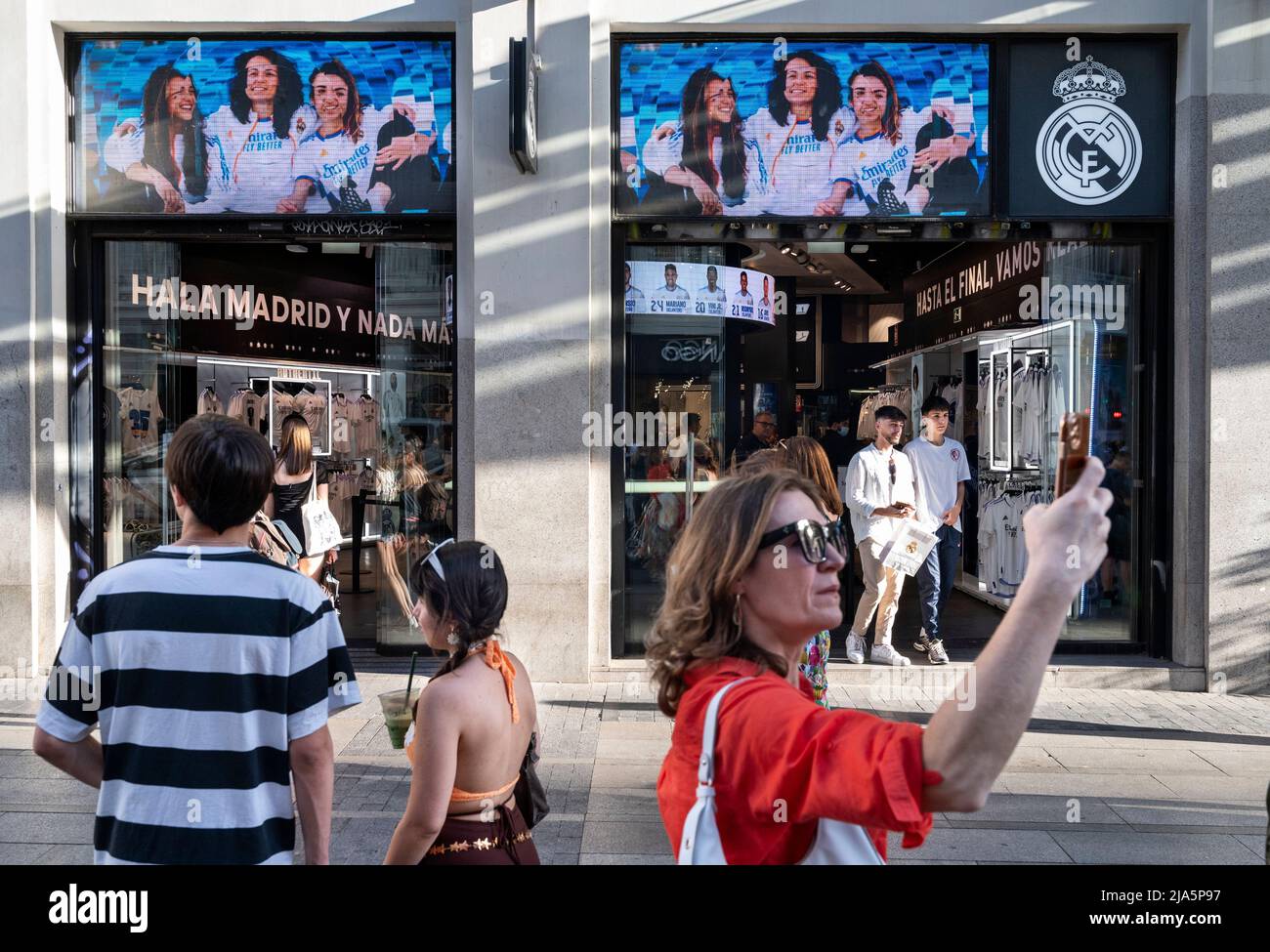 Madrid, Spain. 28th May, 2022. Shoppers and pedestrians are seen at the  Spanish professional football team Real Madrid Club official brand store  and logo in Spain. (Credit Image: © Xavi Lopez/SOPA Images