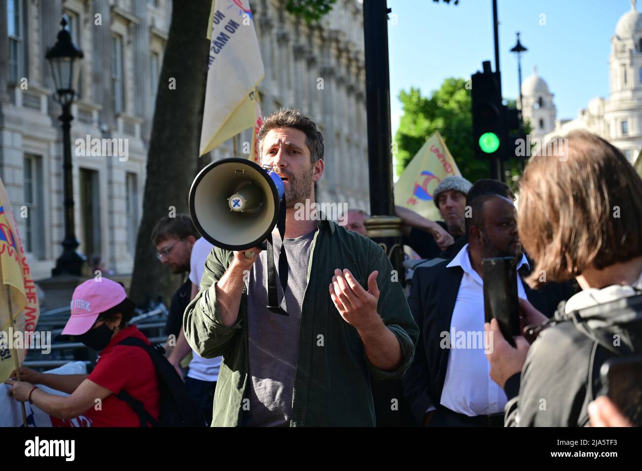 Downing Street, London, UK. 27 May 2022. United Voices of the World union organises a protest outside Downing street as the Sue Gray reveals abuses of staff during the lockdown. Protestors also called for justice for Belly Mujinga and Emanuel Gomes who dies will working during lockdown. Stock Photo