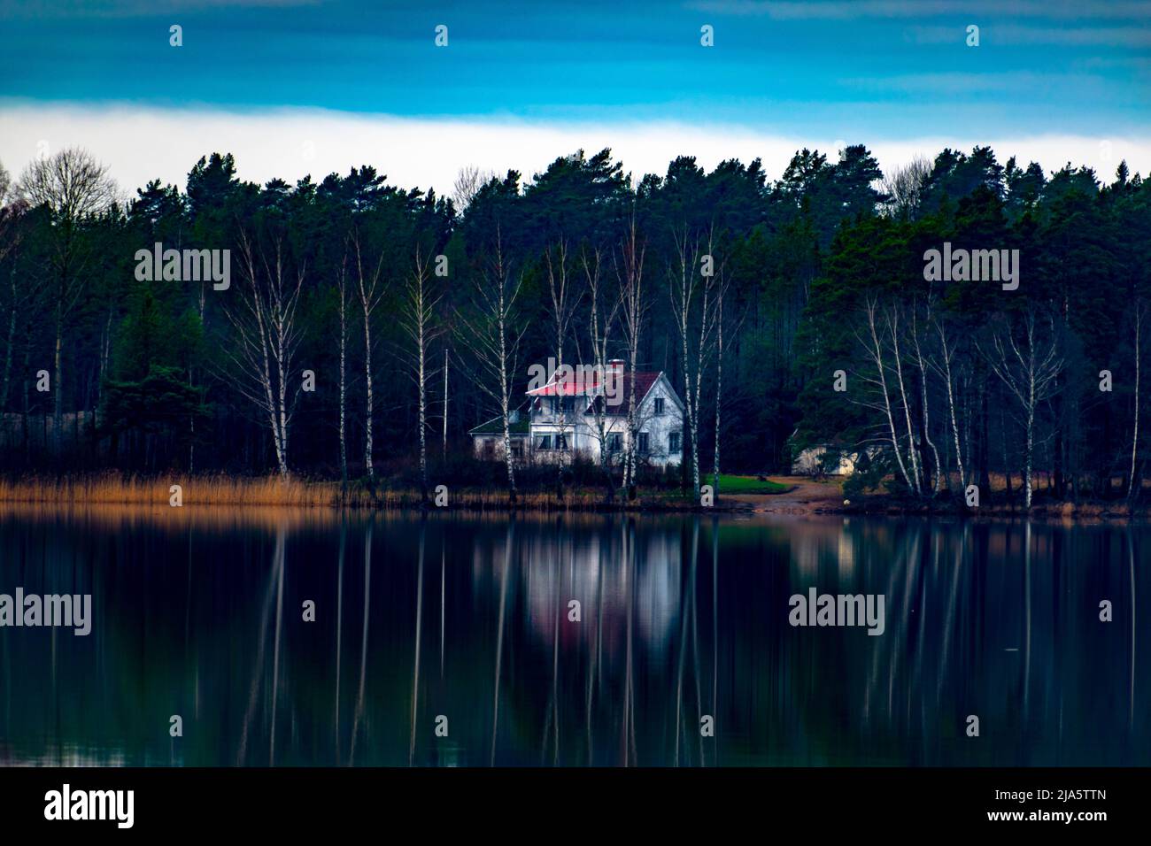 Red house in forest lake hi-res stock photography and images - Alamy