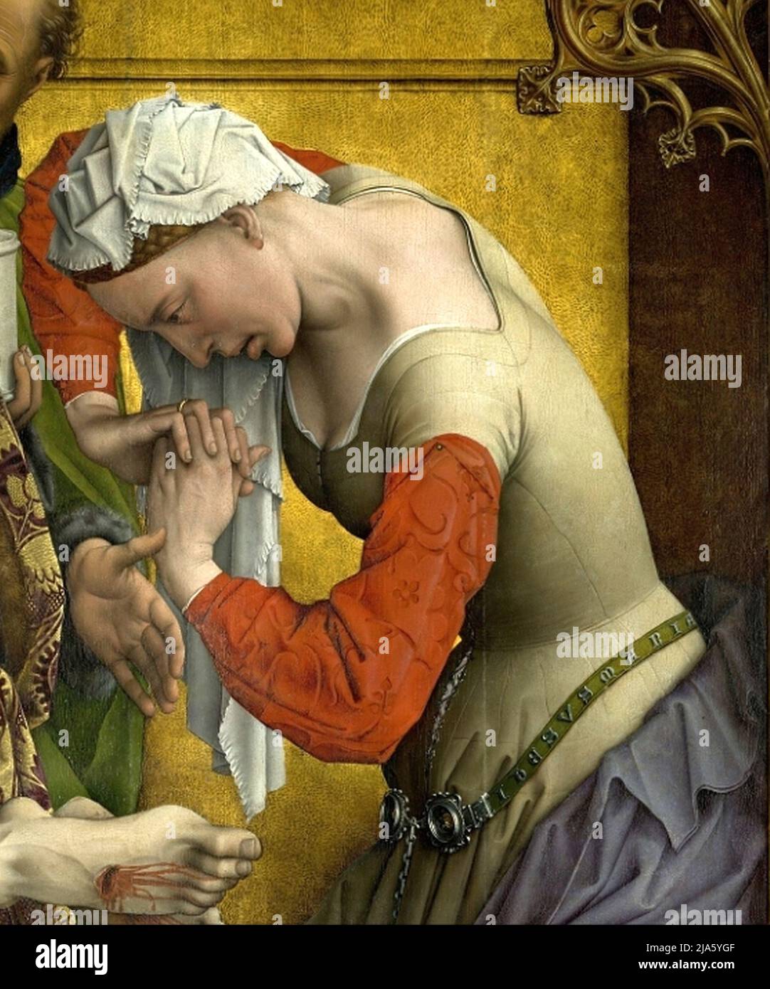 Detail of Mary Magdalene weeping at the crucifixion of Jesus, as portrayed in The Descent from the Cross by the Flemish artist Rogier van der Weyden Stock Photo