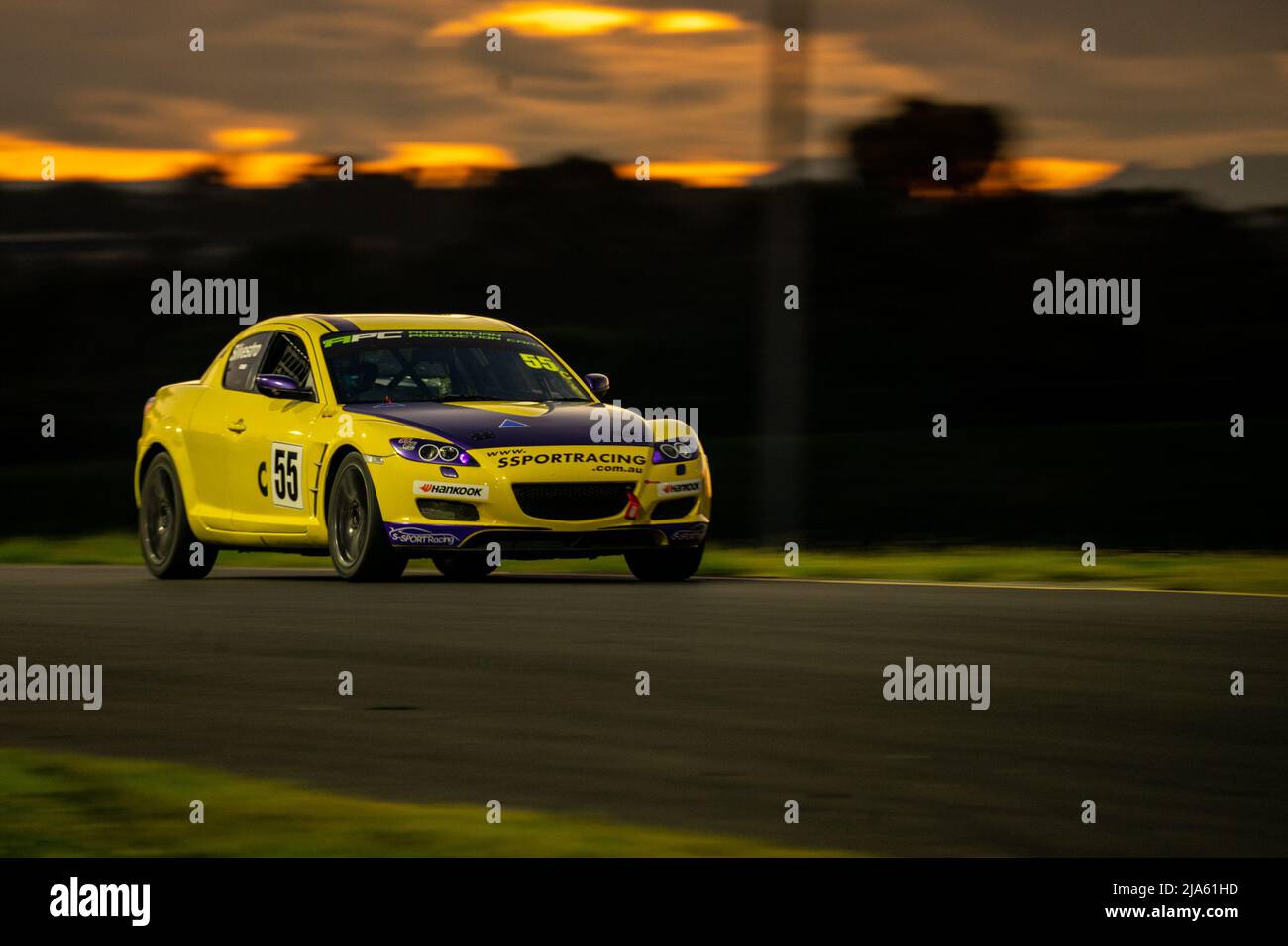 Sydney, Australia. 27 May, 2022. Sam Silvestro piloting his S-Sport Racing Mazda RX-8 through turn 3 at Sydney Motorsport Park as the sun sets. Credit: James Forrester / Alamy Live News. Stock Photo