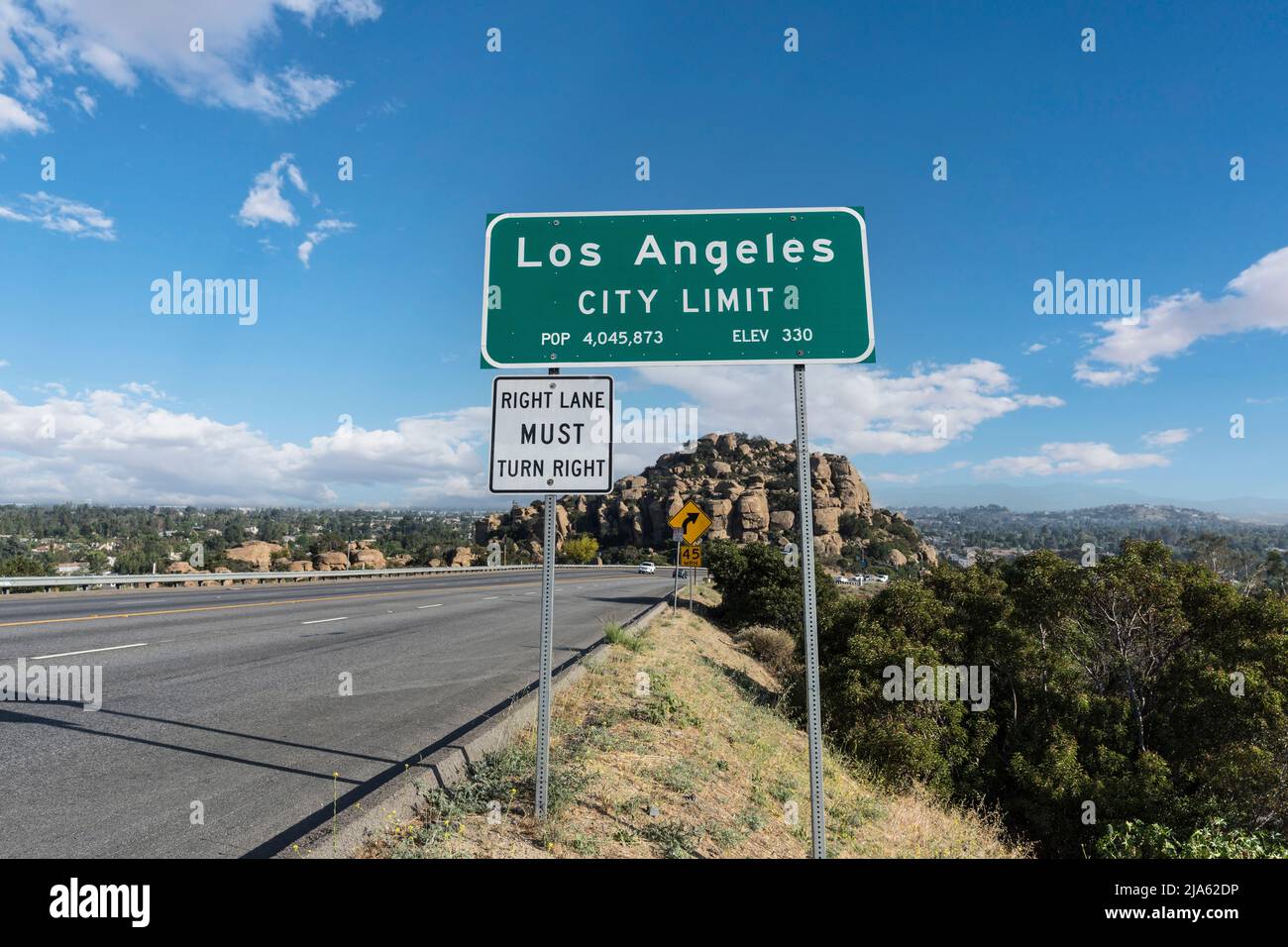 Los Angeles city limit sign on Topanga Canyon Blvd - State Route 27 in Chatsworth, California.  Stoney Point park is in background. Stock Photo