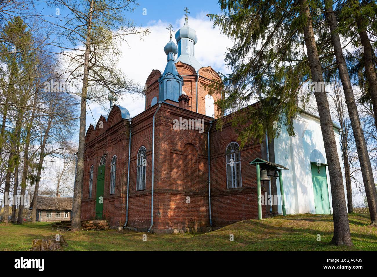 The old church of St. John the Theologian on a sunny May day. Velebitsy, Novgorod region. Russia Stock Photo