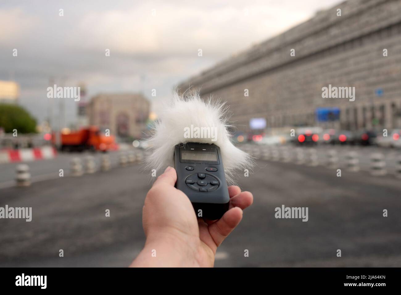 Voice recorder in hand. Recording sound effects, and ADR. Sounds of