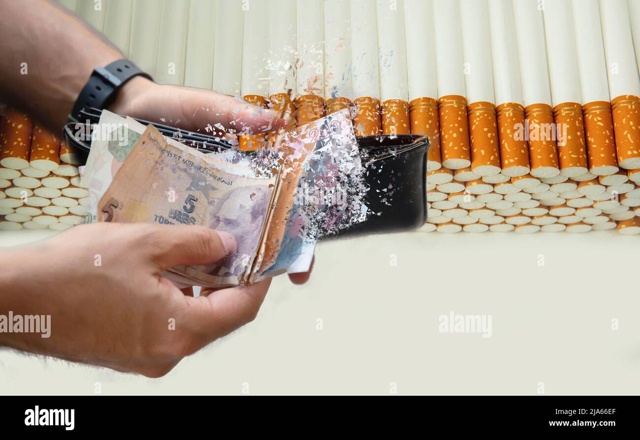 hand giving money to buy cigarettes Stock Photo