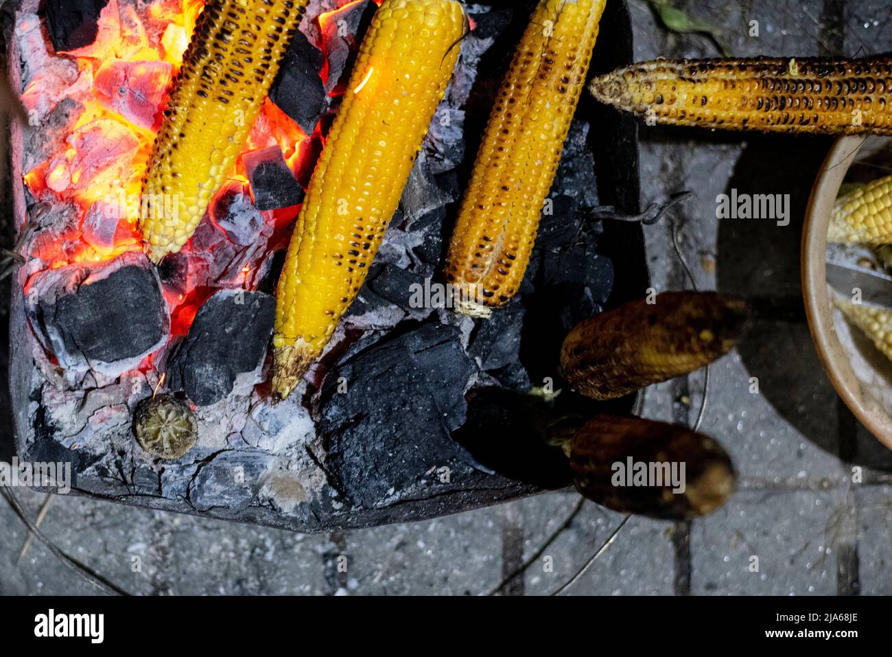 Traditional roasted corn cob in country made oven. Grilled corn